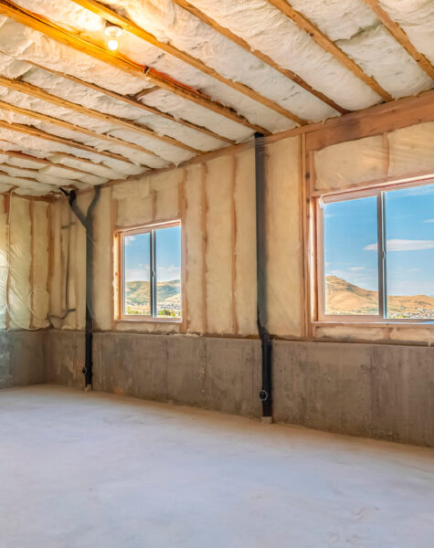 Panorama frame Unfinished room in a new build house. Unfinished room in a new build house showing the exposed ceiling insulation in a receding corner view